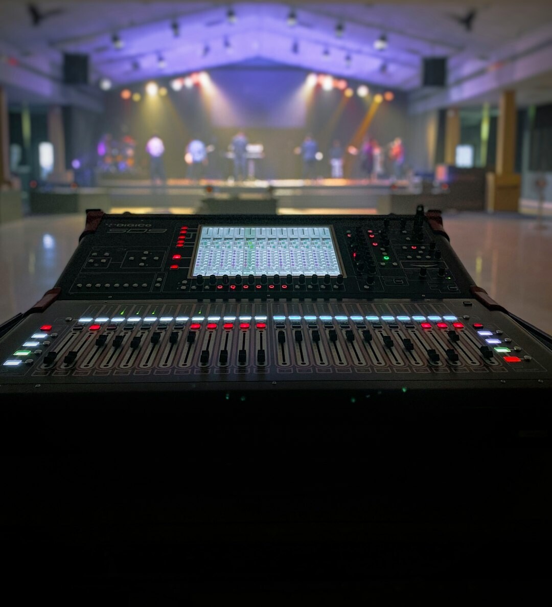 Portrait of a sound engineer at a mixing console