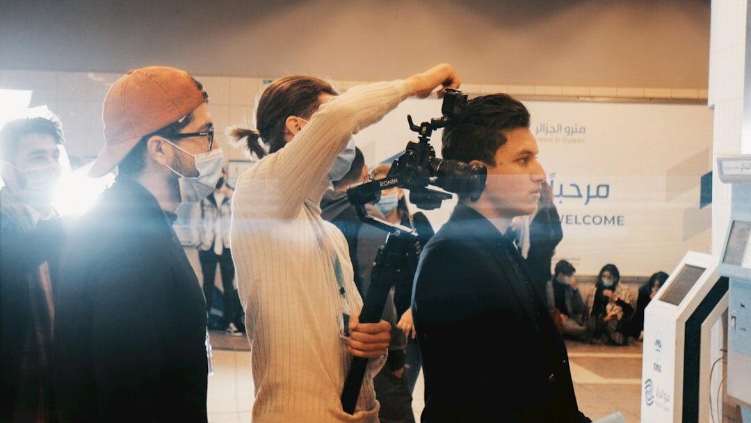 Camera crew and reporters preparing equipment before a press conference